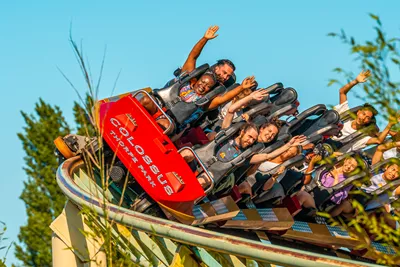 Guests with their arms up on Colossus 
