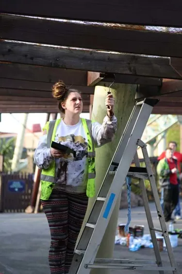 Employee repainting an archway